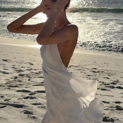 Sola | Flowing Mini Dress – Backless Halter Ruffle Style