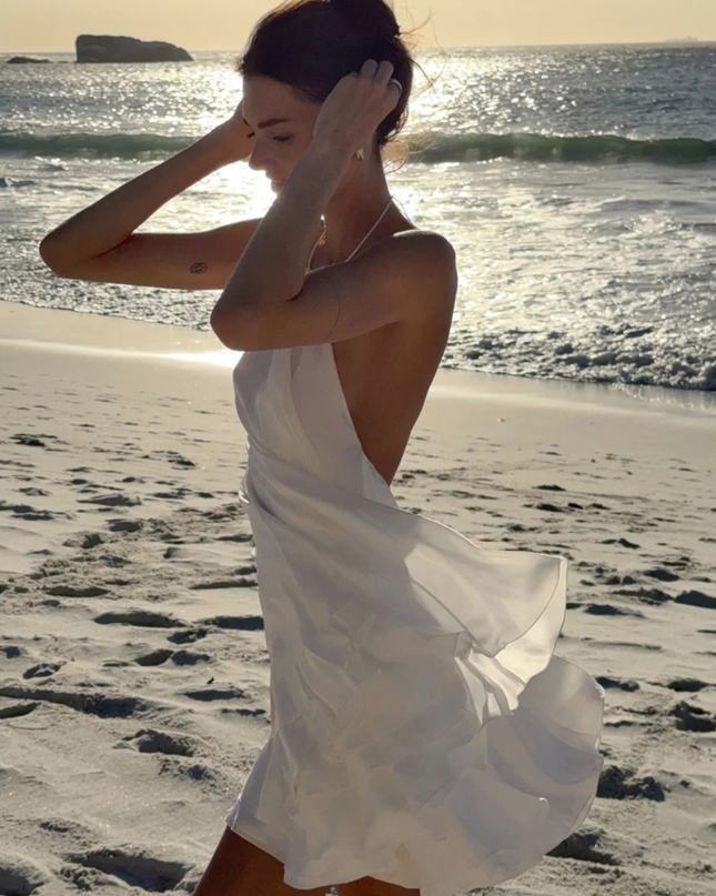Sola | Flowing Mini Dress – Backless Halter Ruffle Style